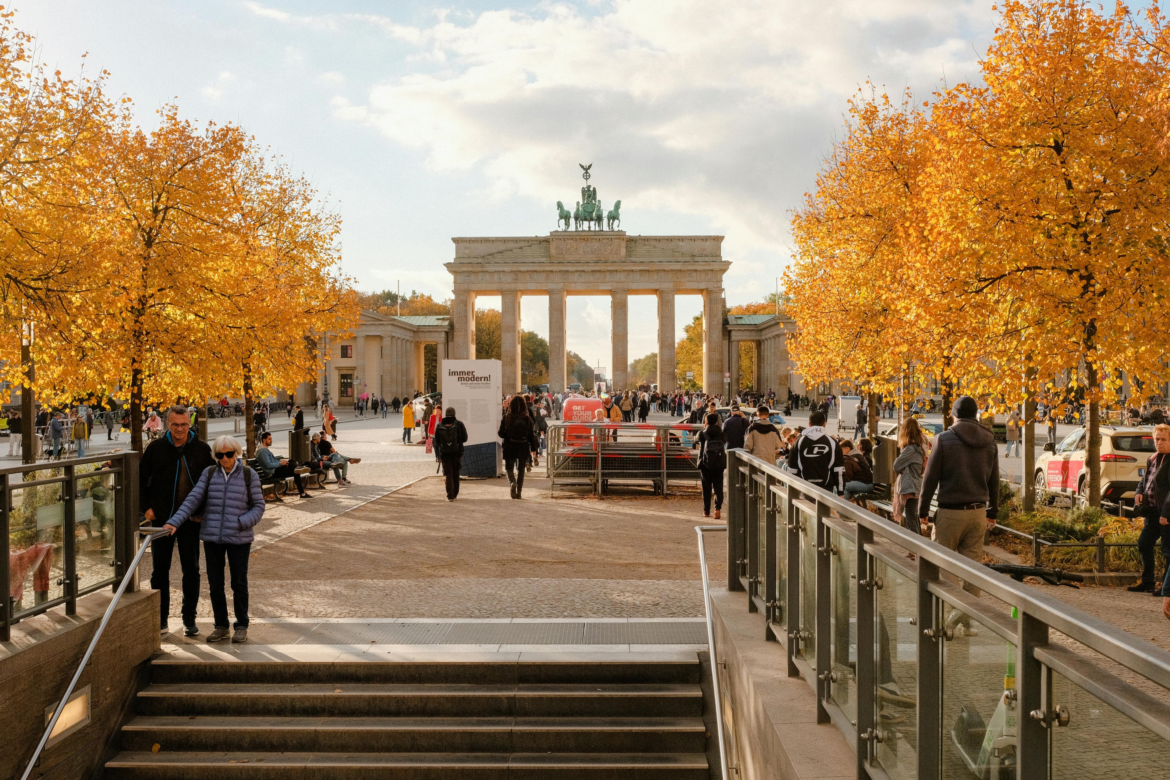 Crowds enjoying a sunny autumn day at Brandenburg Gate, Berlin.