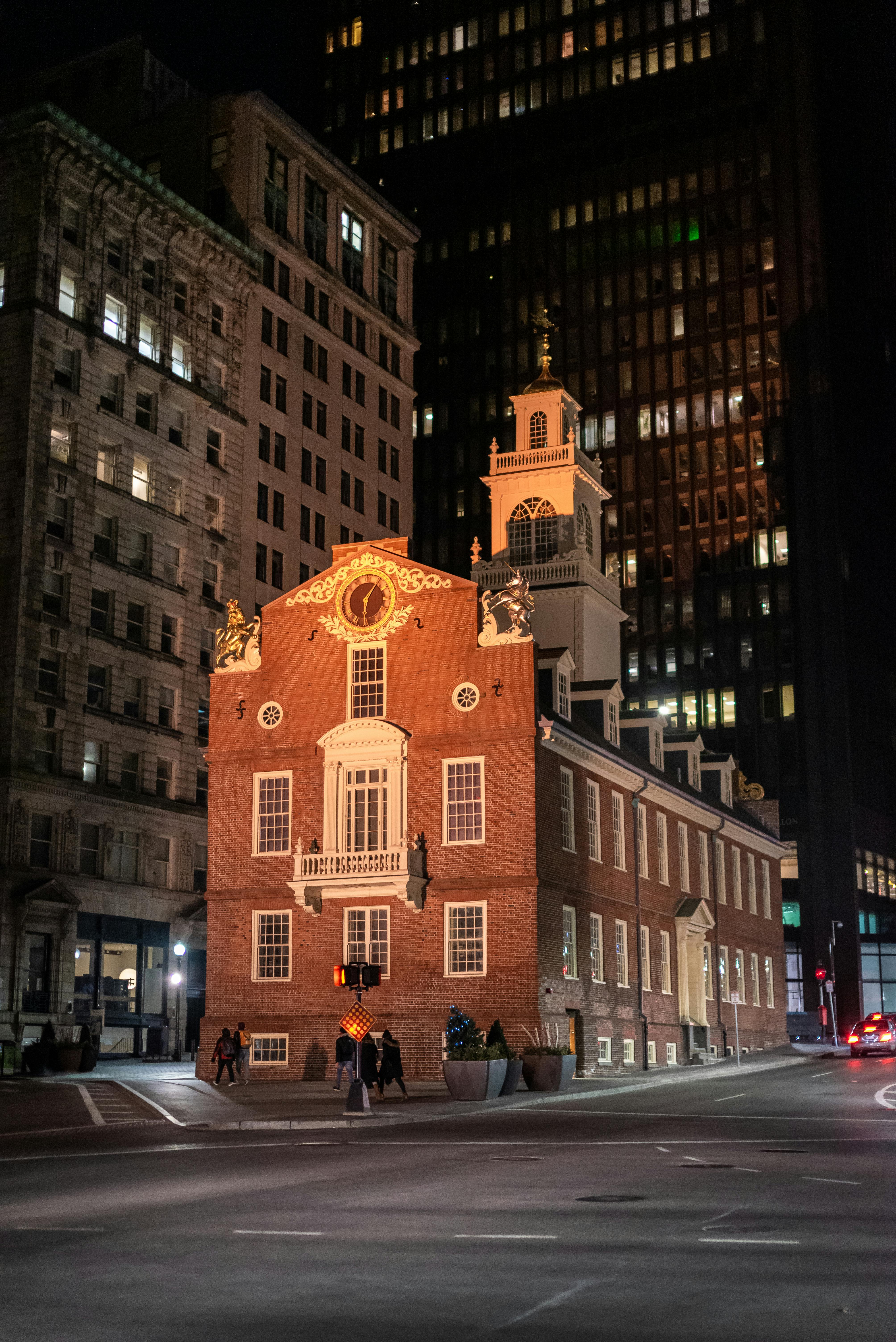 The historic Old State House in Boston illuminated at night, showcasing its architectural charm.