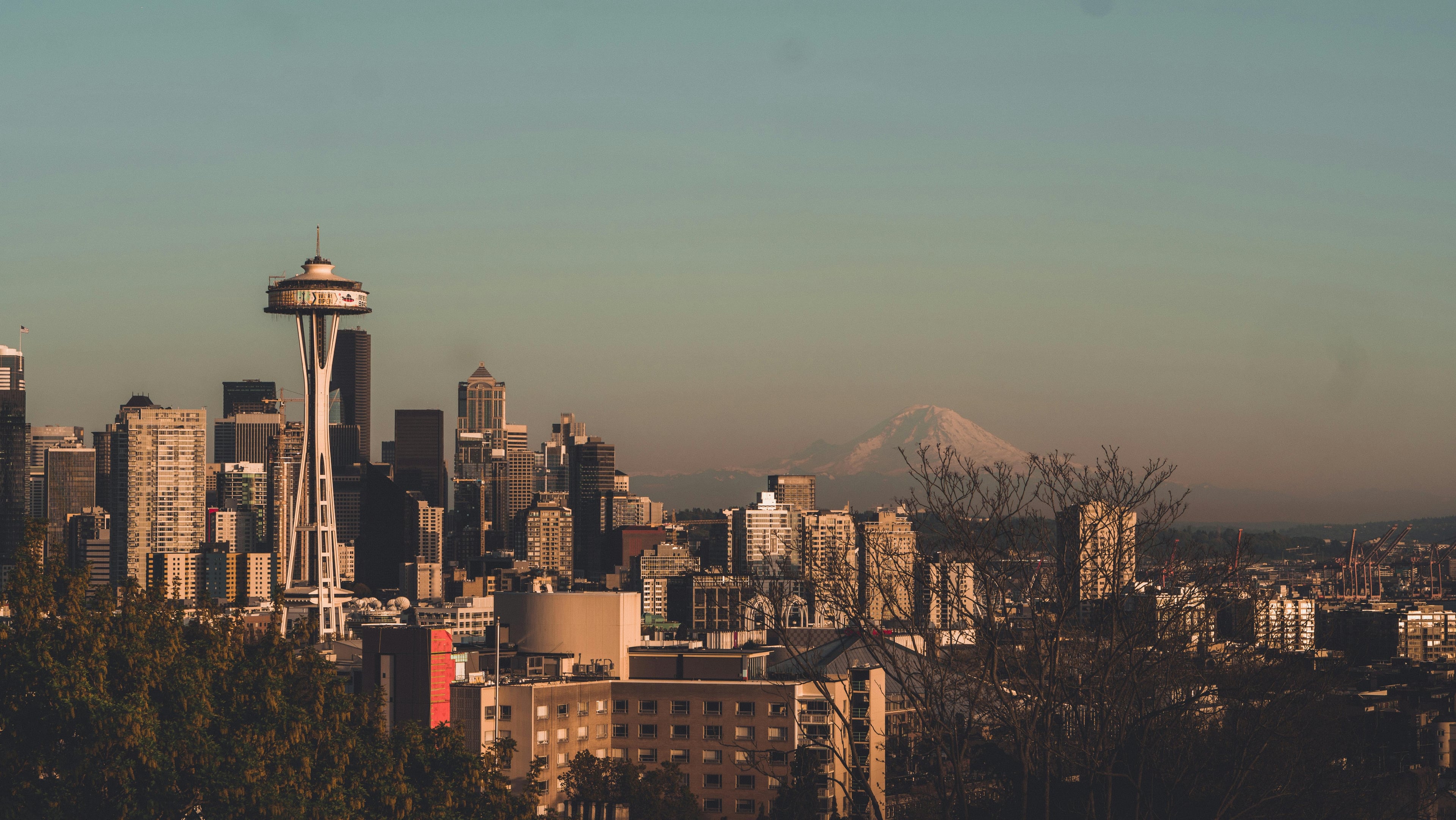 Stunning view of Seattle's skyline featuring the Space Needle with Mount Rainier in the background.