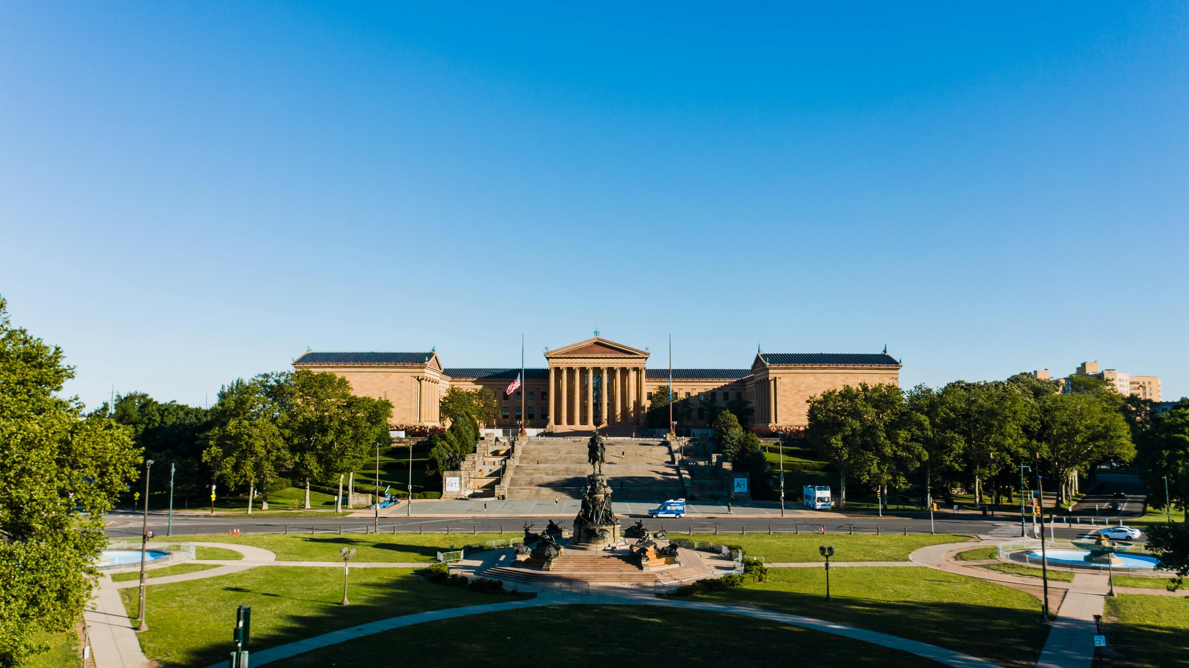 A vibrant view of the Philadelphia Museum of Art with a clear blue sky, representing classic architecture and heritage.