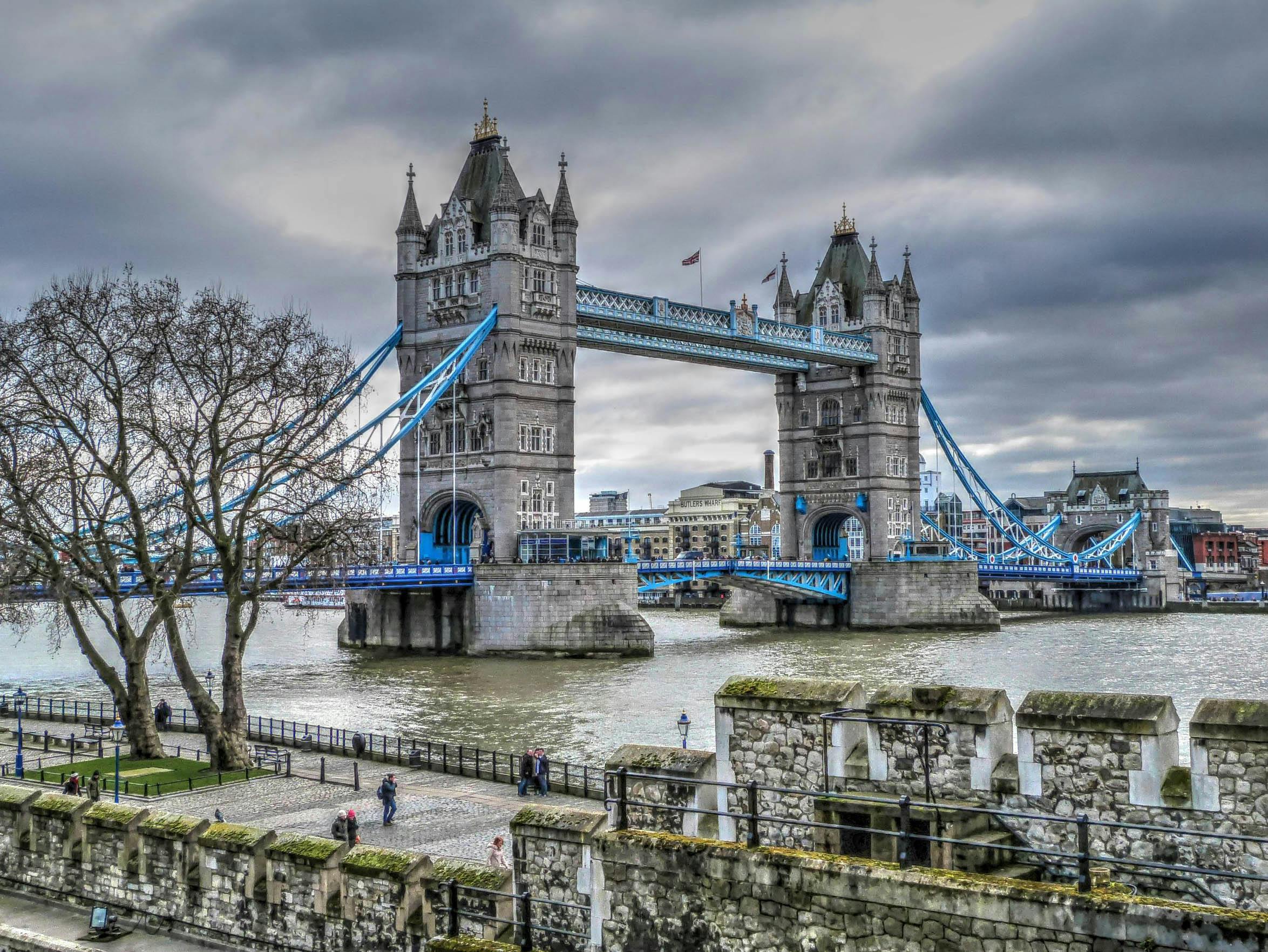 Scenic view of Tower Bridge over the Thames with cloudy sky in London.