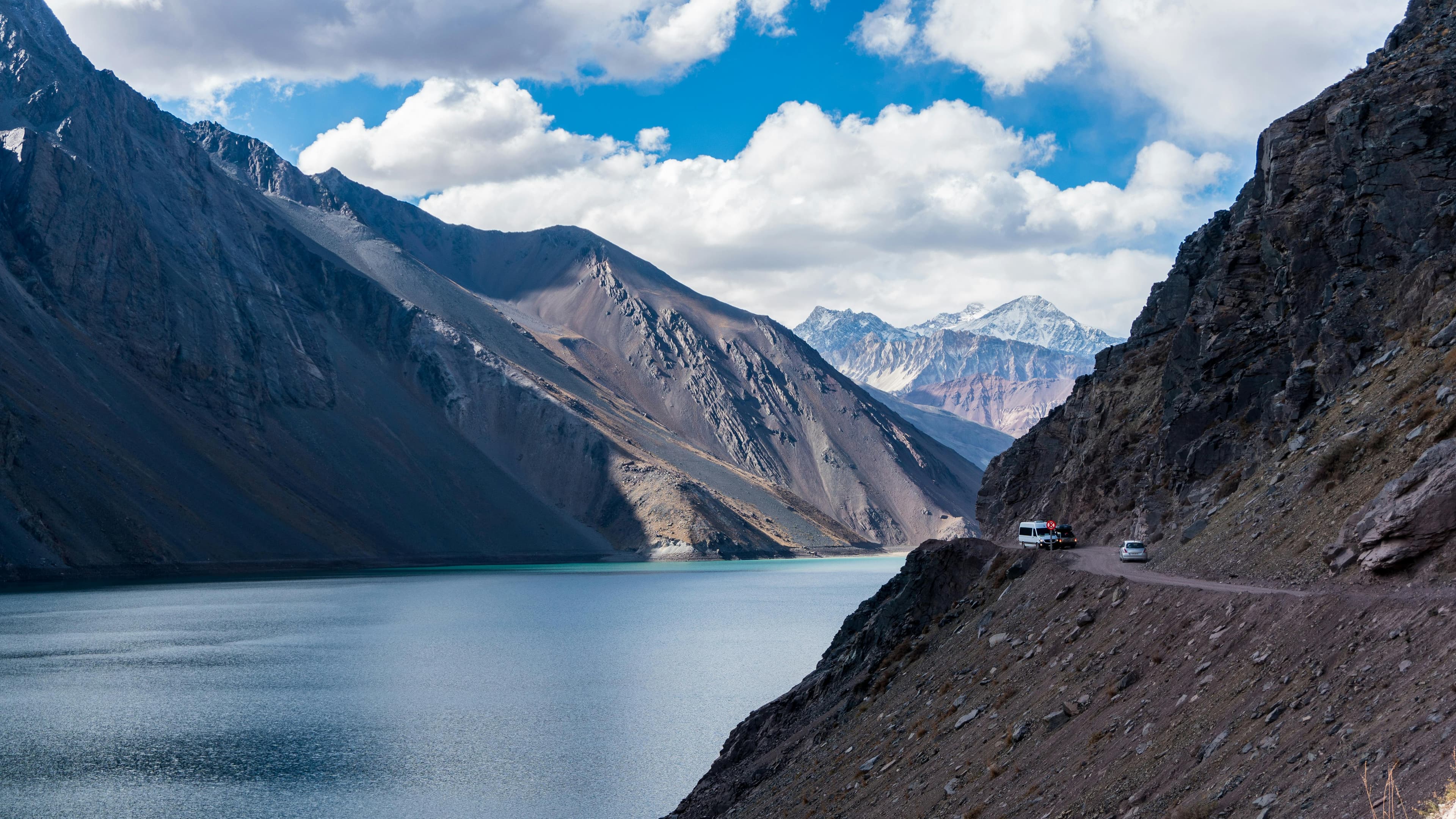 Breathtaking view of the Andes mountains and serene lake in Santiago Metropolitan Region, Chile.