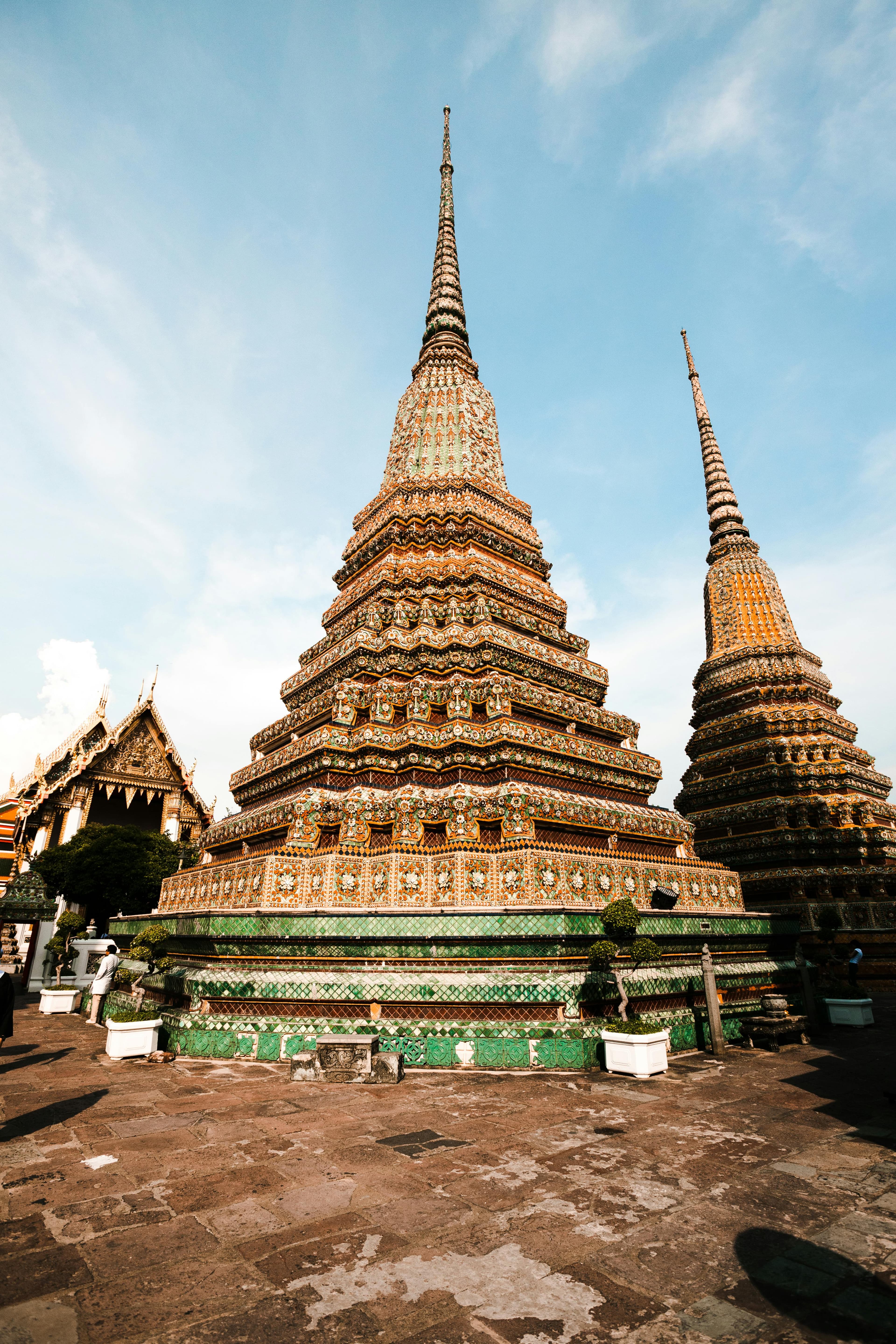 Stunning view of a richly adorned pagoda at Wat Pho temple complex in Bangkok, Thailand.